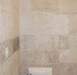 Kronos Limestone cladding used in a master bathroom shower floors and walls