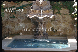 Ancient Reclaimed Stone Wall Fountain with an Angel Cherub Baby Face carved into the back of the fountain. Provenance, the south of France