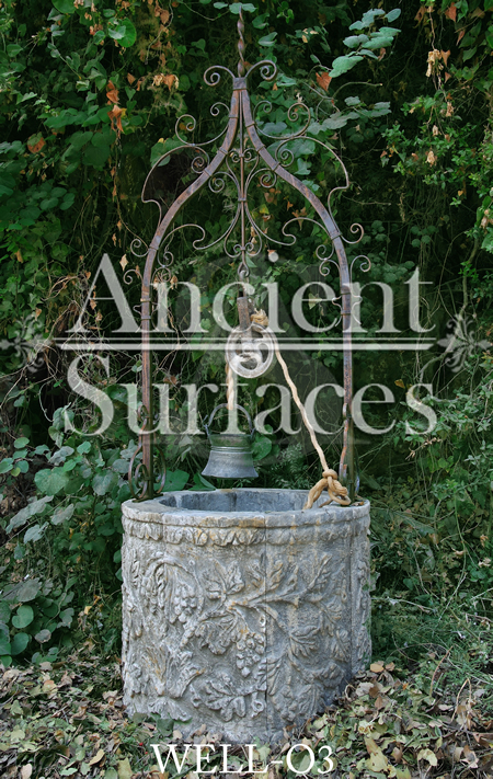 Ancient grape vine motif stone Well head reclaied from Italy with old hand twisted metal work 