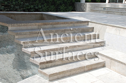 Antique thick Limestone slabs milled at 3" in thickness used as landscaping stairs and pool and spa stairs, salvaged from the bottom of farm house foundations