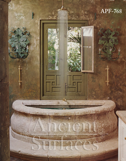 antique fountain transformed into a stone shower tub