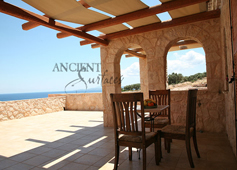 Umbrian Limestone cladding used on a veranda wall of a coastal Mediterranean Villa in Italy