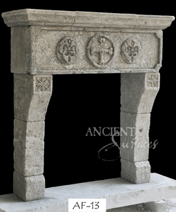 An impressive stone fireplace with a carved panel