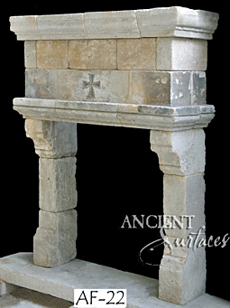 an important example of a reclaimed medieval era limestone fireplace mantle available in our local stock