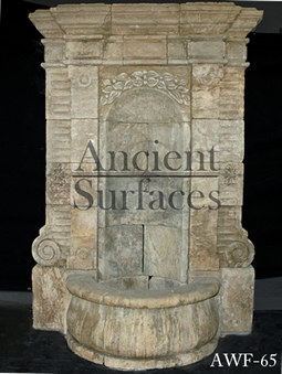 A 17th century antique French stone wall fountain salvaged from the south of France