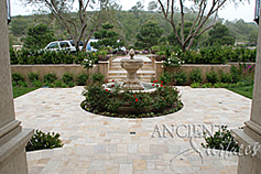 Ancient Reclaimed 'Arcane Stone' pavers salvaged from 17th century era homes, villas and farmhouses from sleepy southern European towns and villages. In this picture this limestone is shown installed on front yard of this picturesque coastal Mediterranean home. The Arcane Stone is perfect for all types of external and internal weather conditions and traffic volumes.