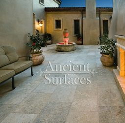 Millenium Limestone flooring wide planks installed in a front courtyard of a mediterranean style coastal beach villa