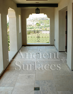 Millenium Limestone flooring wide planks installed in the patio of a mediterranean style coastal beach villa