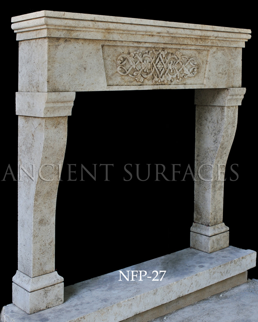 A well carved Louis XV style stone fireplace