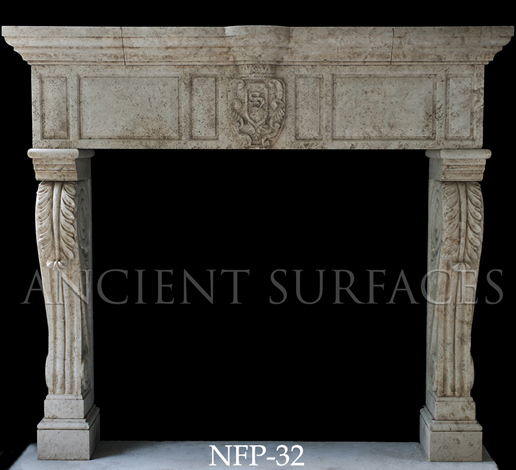 A Tudor style limestone fireplace mantel