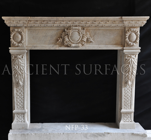 a hand carved kitchen hood stone surround