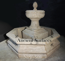 Hand carved tiered octagonal limestone pool fountain