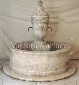 Hand carved rounded limestone pool fountain