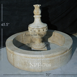 Hand carved rounded limestone pool fountain