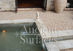 Antique thick Limestone slabs milled at 3" in thickness used as landscaping water channelling, Jacuzzi spa coping and aqueducting bathroom, salvaged from the bottom of farm house foundations