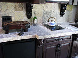Antique thick Limestone slabs milled at 3" in thickness used as vanity counter tops in a powder room, salvaged from the bottom of farm house foundations