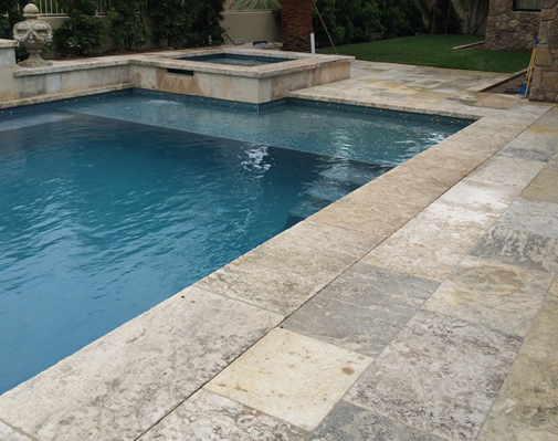 Antique Limestone Floors the Millennium Selection installed in a Newport Beach Pool Patio and Jacuzzi