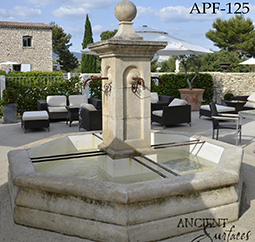 Antique rounded pool fountain from the 16th century with a middle pedestal and urn