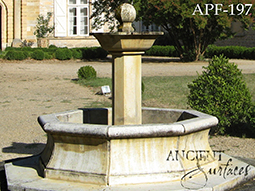 antique pool fountain with a gargoyle head