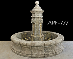 antique stone fountain in the courtyard with planters