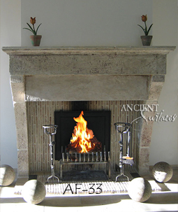 An antique Stone Fireplace by Ancient Surfaces