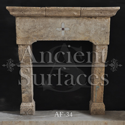 An antique Stone Fireplace by Ancient Surfaces