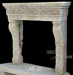 An antique Stone Fireplace by Ancient Surfaces