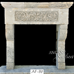 An antique Stone Fireplace by Ancient Surfaces