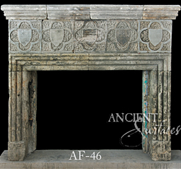 An antique Stone Fireplace by Ancient Surfaces