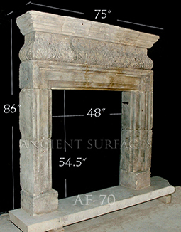 An antique Stone Fireplace by Ancient Surfaces