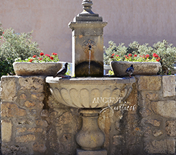 Ancient Reclaimed Stone Wall Fountain with an Angel Cherub Baby Face carved into the back of the fountain. Provenance, the south of France