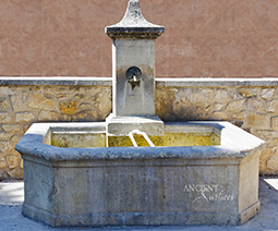 A beautiful 17th century antique reclaimed limestone wall fountain salvaged from the south of France