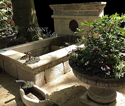 A beautiful 17th century antique reclaimed limestone wall fountain salvaged from the south of France