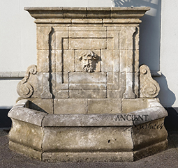 A beautiful 17th century antique reclaimed limestone wall fountain salvaged from the south of France