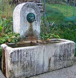 A beautiful 17th century antique reclaimed limestone wall fountain salvaged from the south of France