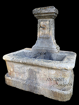 A beautiful 17th century antique reclaimed limestone wall fountain salvaged from the south of France