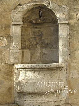 A beautiful 17th century antique reclaimed limestone wall fountain salvaged from the south of France