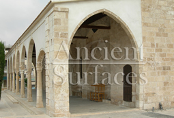kronos limestone in situ on the wall of an old medieval courtyard of a castle villa