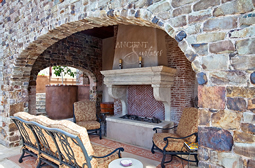 This Stone fireplace has nice corbelled legs supporting a simple piece Tuscan style lintel