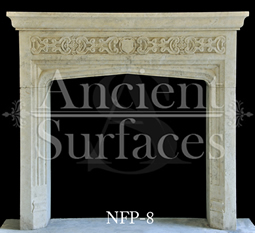 A Tudor style limestone fireplace mantel