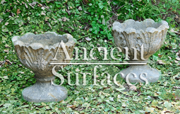 A pair of antique French Empire stone planters circa 19th century covered with acanthus motifs great for planting Brackens in.