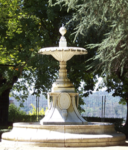 Hand carved rounded limestone pool fountain