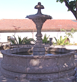 Hand carved rounded limestone pool fountain