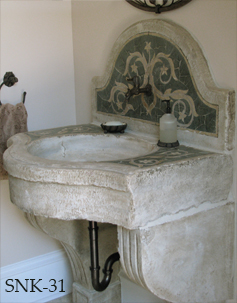 Antique reclaimed stone basin sink salvaged restored and installed in this traditional style Mediterranean home.