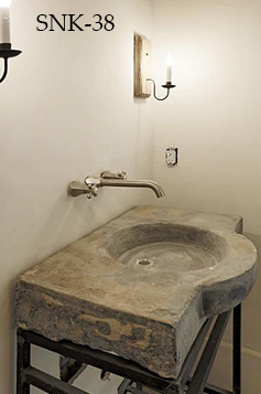 Antique reclaimed stone basin sink salvaged restored and installed in this traditional style Mediterranean home.