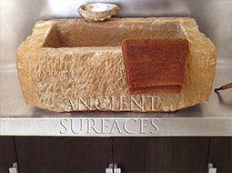 Unique farmhouse style avant-garde rough cleft sink hand carved out of a single antique limestone block ideal for any powder room or wine cellar type of application