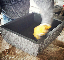 Old Basalt block carved into a solid basalt sink