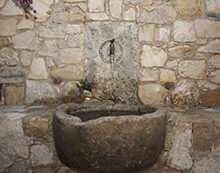 Unique farmhouse style avant-garde rough cleft sink hand carved out of a single antique limestone block ideal for any powder room or wine cellar type of application