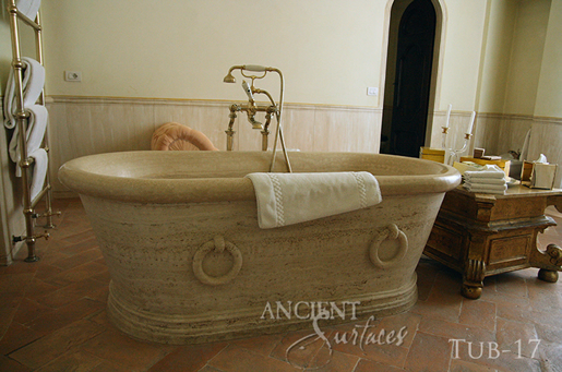 The 'Arcane stone' are ancient reclaimed limestone flooring tiles from the 17th century and later. Pavers in this photo are shown installed on a pool deck overlooking the bay in coastal Californian town