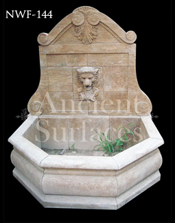 Hand carved lion head stone wall fountain